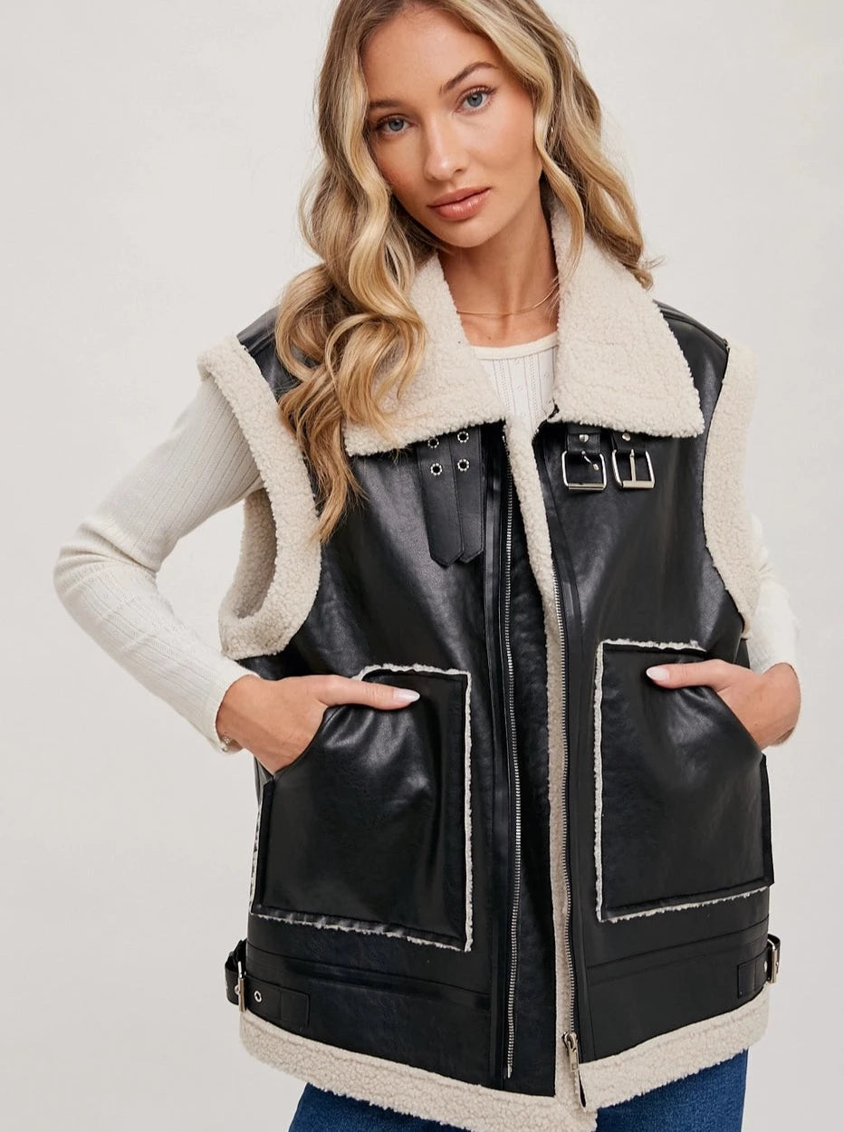 Vegan Leather Vest  Shearling Vegan Leather Moto Vest Sherpa Collar Pockets Buckle Details 55% Polyester, 45% Polyurethane Color: Multiple