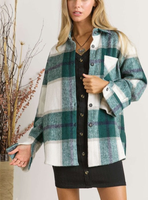 We The Free Plaid Shacket  Plaid Long Sleeve Button Down Plus Size Available 100% Polyester Color: Navy, Hunter Green This We The Free Plaid Shacket is perfect for adding a laid-back vibe to your wardrobe, with a stylish plaid pattern. It features a lightweight, button-down design, making it a comfortable choice for any season.