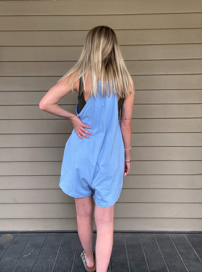 Cozy Up Tank Romper - Blue  Oversize Tank V-neck Solid Jersey Romper Effortless and oversized silhouette Racerback Oversized patch pockets Dropped armholes Soft and comfy onesie features a slouchy 95% Cotton, 5% Spandex Color: Blue