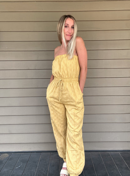 Honey Tube Jumpsuit - Honey Gold  Tube Jumpsuit Drawstring elastic waist  Pockets 80% Cotton, 10% Linen, 10% Polyester  Color: Honey Gold