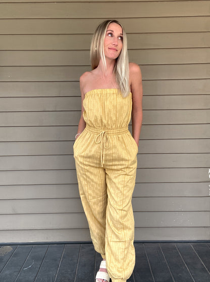 Honey Tube Jumpsuit - Honey Gold  Tube Jumpsuit Drawstring elastic waist  Pockets 80% Cotton, 10% Linen, 10% Polyester  Color: Honey Gold