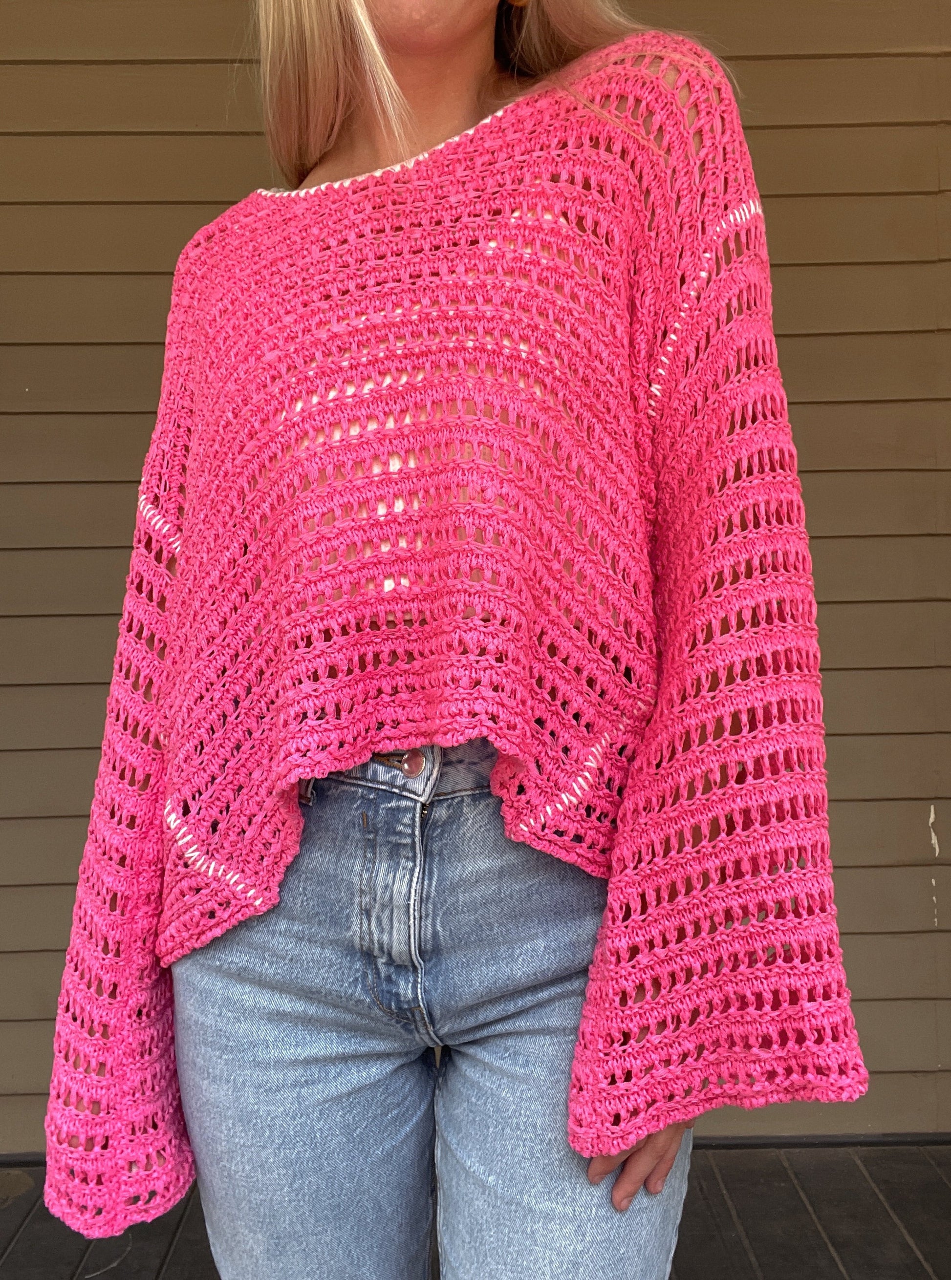 True Romance Open Knit Sweater - Pink  Open Knit Sweater Tie Back  Crochet Top 53% Acrylic, 47% Nylon Color: Pink Look stylish and feel relaxed with this pink True Romance Open Knit Sweater. Crafted with a delicate crochet top, this sweater is the perfect piece to keep you comfortable and fashionable. The classic design makes it easy to pair with any outfit for a stunning look.