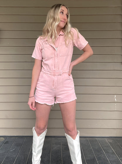 Adventure Denim Romper - Washed Pink  Denim Romper Zipper Pockets 100% Cotton Color: Washed Pink Ready for a wild adventure? The Adventurer Denim Romper is the perfect outfit for a daring escapade! The pink and button up design will keep you looking stylish, while the collar adds an air of sophistication - talk about an adventurers dream!