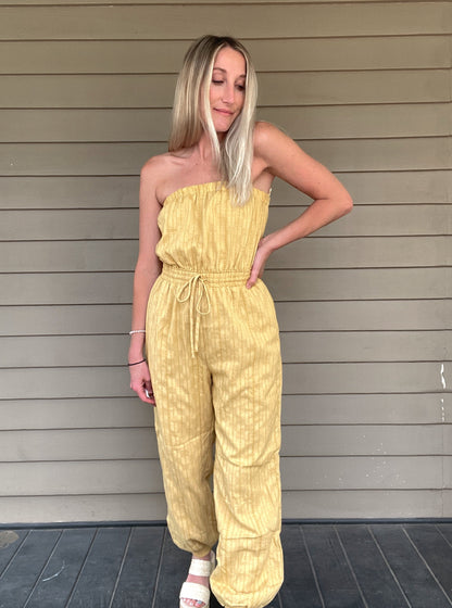 Honey Tube Jumpsuit - Honey Gold  Tube Jumpsuit Drawstring elastic waist  Pockets 80% Cotton, 10% Linen, 10% Polyester  Color: Honey Gold