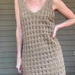 By The Sea Crochet Mini Dress  Crochet Knitted Dress 67% Acrylic, 33% Nylon Color: Mocha The By The Sea Crochet Mini Dress is perfect to layer on over your favorite bikini. Crafted with lightweight, breathable crochet, this dress is perfect for hot days in the sun. Effortlessly throw it on for a day in the sand or a night out.
