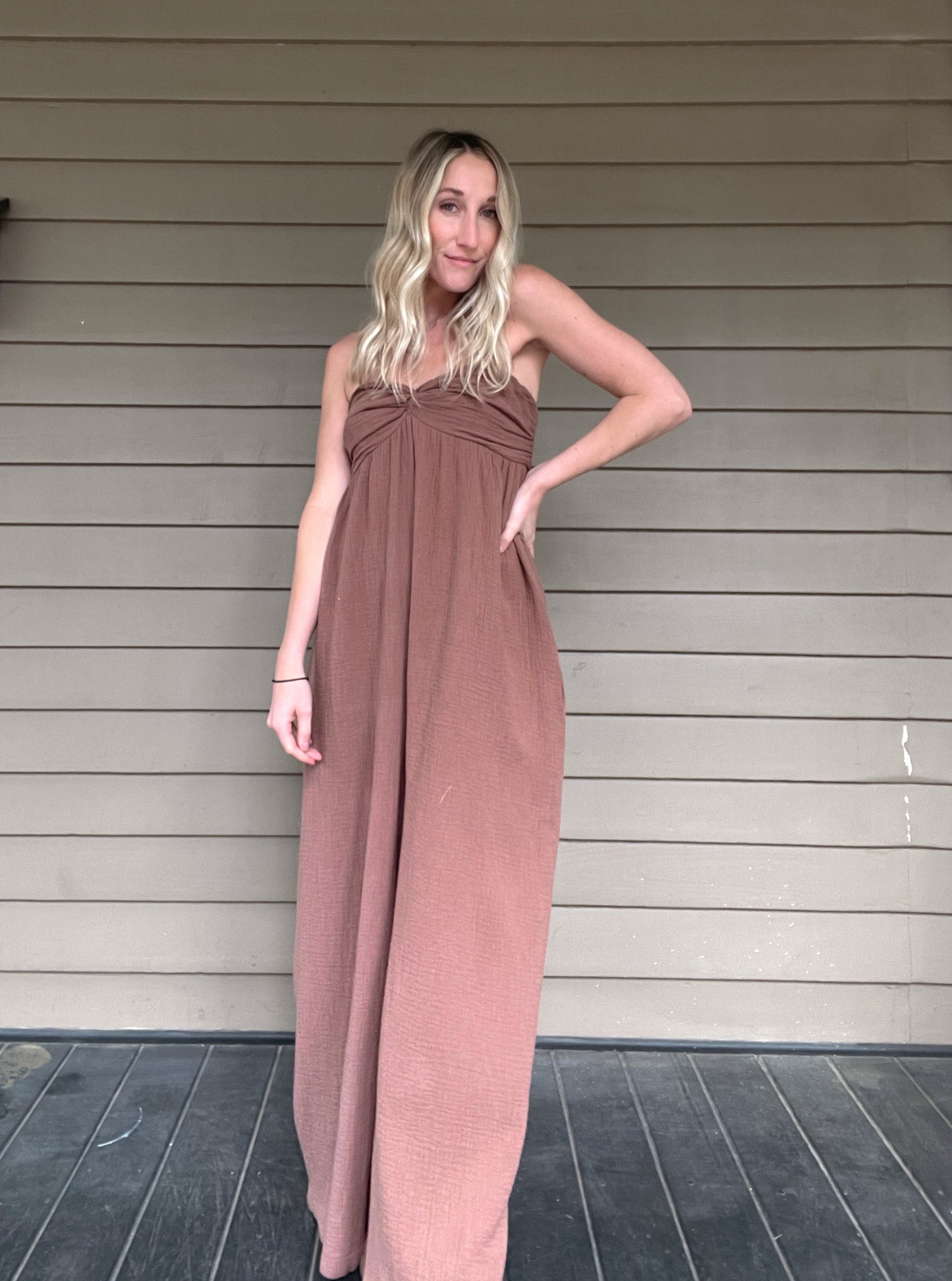 Moroccan Strapless Jumpsuit - Mocha  Wide leg strapless jumpsuit Twisted bust Wide leg Pockets 100% Cotton Color: Mocha Step out in style with this Moroccan Strapless Jumpsuit. This wide leg boho jumpsuit provides elegance and comfort. Crafted from quality materials, this jumpsuit will make a statement while keeping you comfortable throughout the day. Perfect for any special occasion.