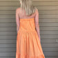 Twisted adjustable spaghetti strap tube crop top  Smocked back Flared ruffle tier maxi skirt Skirt has side invisible zipper Use skirt and wear it as a strapless tiered ruffle dress 100% Cotton Color: Orange This oversized romper is perfect for those cozy days or balmy summer nights. Made from premium material, this lightweight romper offers a breathable yet comfortable fit that won't weigh you down. Perfect with a pair of sandals or sneakers, this romper is sure to be a summer staple.