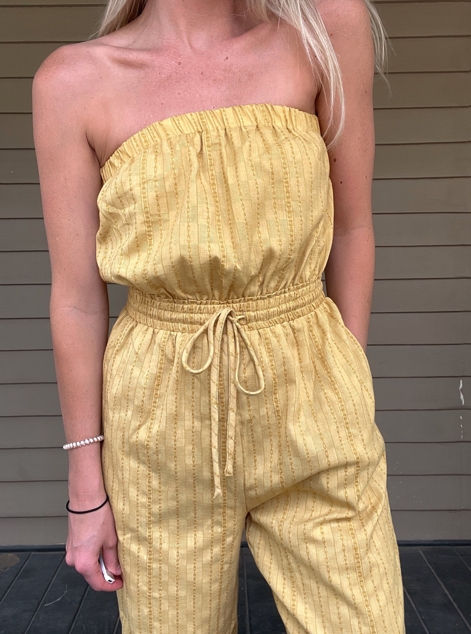 Honey Tube Jumpsuit - Honey Gold  Tube Jumpsuit Drawstring elastic waist  Pockets 80% Cotton, 10% Linen, 10% Polyester  Color: Honey Gold