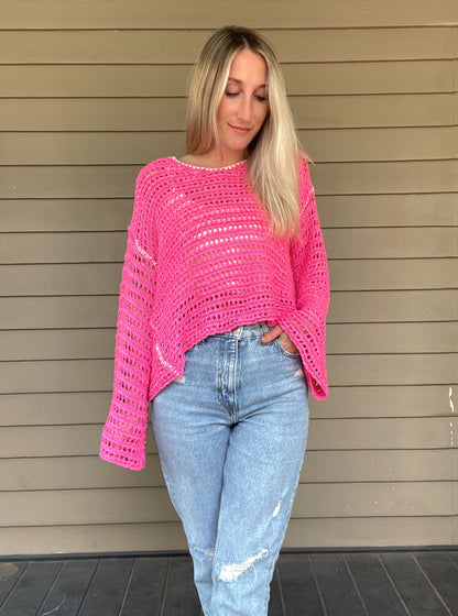 True Romance Open Knit Sweater - Pink  Open Knit Sweater Tie Back  Crochet Top 53% Acrylic, 47% Nylon Color: Pink Look stylish and feel relaxed with this pink True Romance Open Knit Sweater. Crafted with a delicate crochet top, this sweater is the perfect piece to keep you comfortable and fashionable. The classic design makes it easy to pair with any outfit for a stunning look.