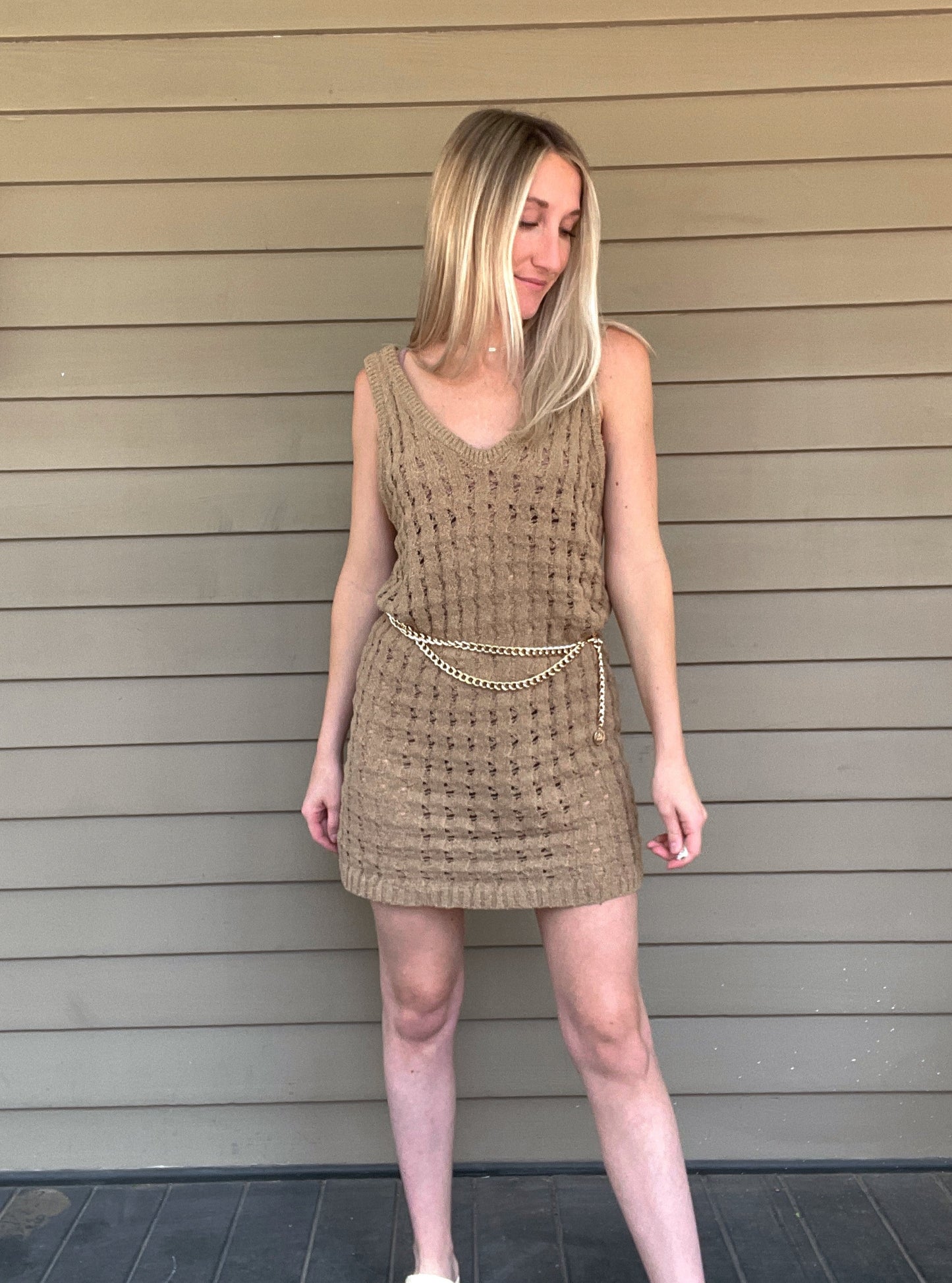 By The Sea Crochet Mini Dress  Crochet Knitted Dress 67% Acrylic, 33% Nylon Color: Mocha The By The Sea Crochet Mini Dress is perfect to layer on over your favorite bikini. Crafted with lightweight, breathable crochet, this dress is perfect for hot days in the sun. Effortlessly throw it on for a day in the sand or a night out.