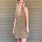 By The Sea Crochet Mini Dress  Crochet Knitted Dress 67% Acrylic, 33% Nylon Color: Mocha The By The Sea Crochet Mini Dress is perfect to layer on over your favorite bikini. Crafted with lightweight, breathable crochet, this dress is perfect for hot days in the sun. Effortlessly throw it on for a day in the sand or a night out.