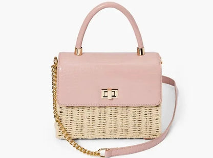 A chic mini satchel shoulder purse composed of a sturdy woven straw body. Also incorporates faux croc vegan leather detailing on the front flap and structured single top handle.