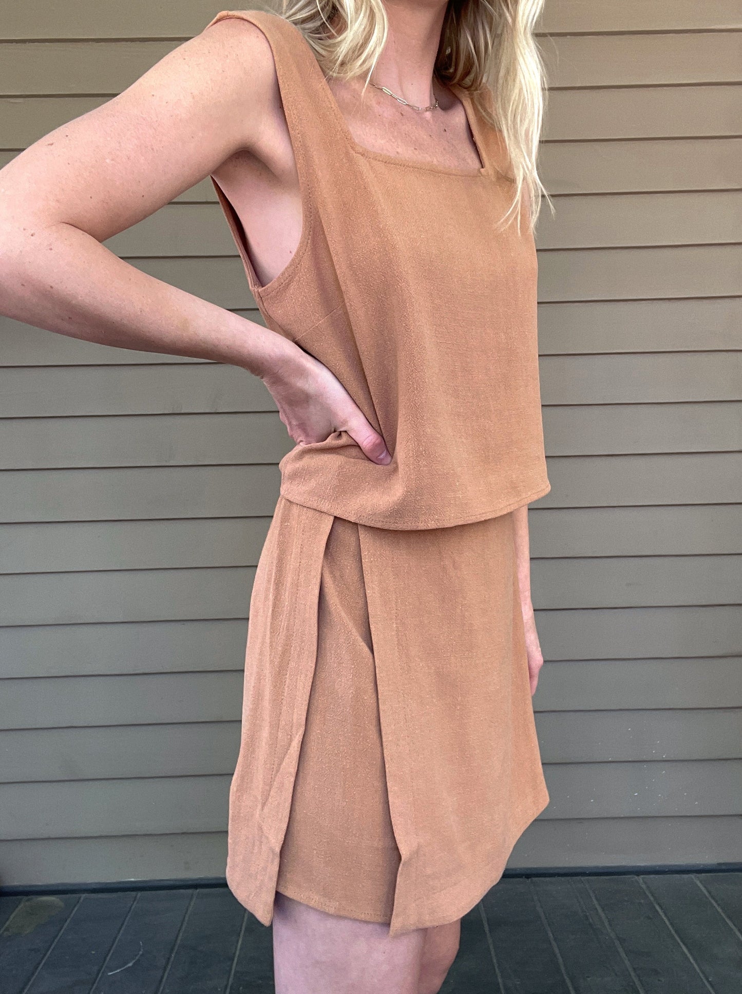 Out West Tank Top and Skirt Set  Tank top and skirt set Loose tank top Side button details on skirt Mini skirt 70% Rayon, 30% Linen Color: Tan