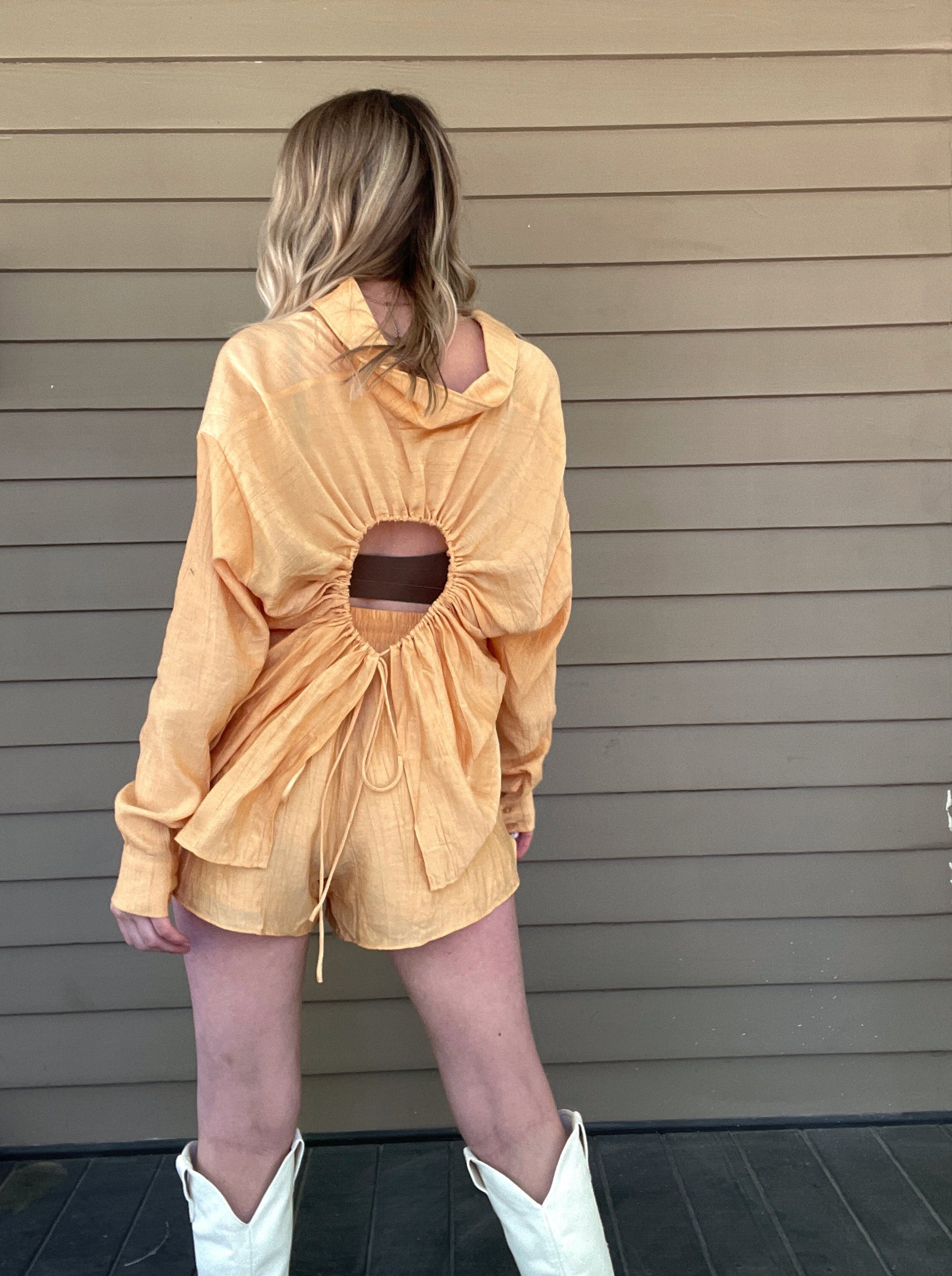 Clementine Crush Set  Shirt and shorts set Cut out back shirt Button up top Draw string shorts Pockets 82% Rayon, 18% Nylon Color: Tangerine