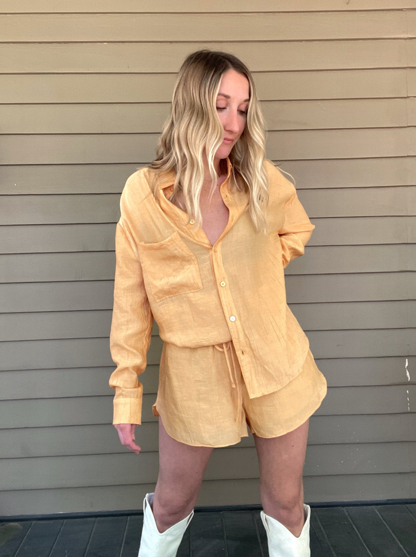 Clementine Crush Set  Shirt and shorts set Cut out back shirt Button up top Draw string shorts Pockets 82% Rayon, 18% Nylon Color: Tangerine