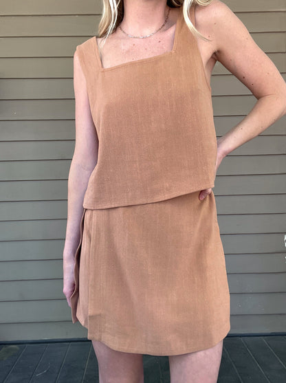 Out West Tank Top and Skirt Set  Tank top and skirt set Loose tank top Side button details on skirt Mini skirt 70% Rayon, 30% Linen Color: Tan